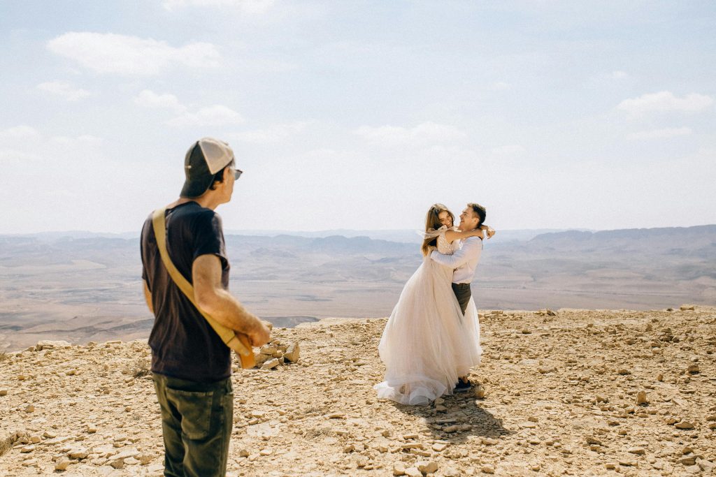Wedding photographer working with couples